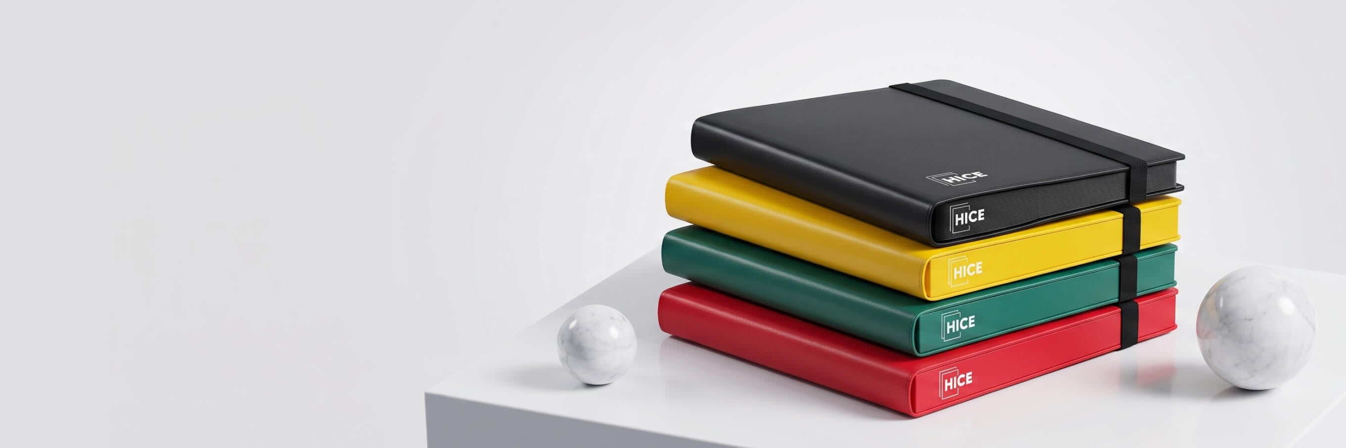 Stack of coloured HICE card binders